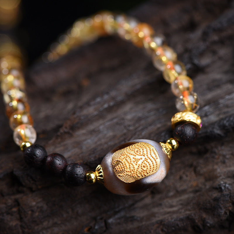 Intense focus on the textures of agate and rutilated quartz in the Multi-Strand Mala, showcasing their distinct and complementary properties.